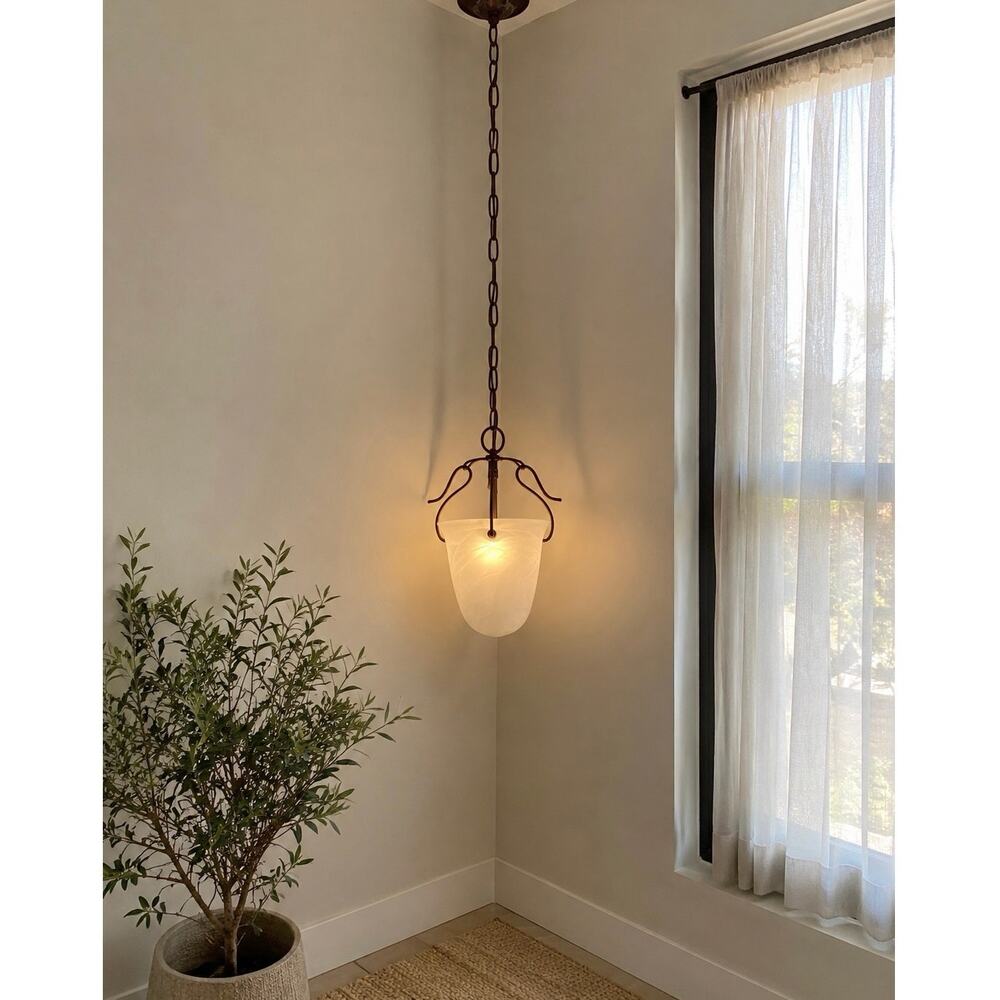 Vintage bronze pendant light features an alabaster glass shade ceiling light